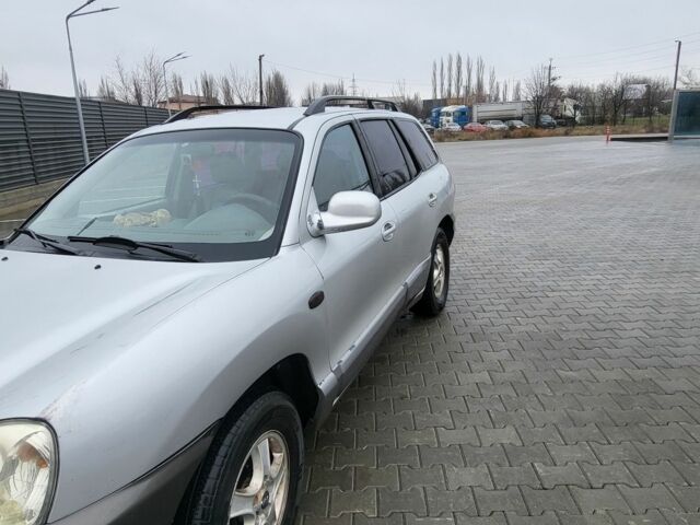 Серый Хендай Санта Фе, объемом двигателя 2.7 л и пробегом 327 тыс. км за 4000 $, фото 1 на Automoto.ua