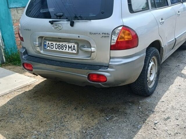 Серый Хендай Санта Фе, объемом двигателя 2.4 л и пробегом 235 тыс. км за 5100 $, фото 1 на Automoto.ua