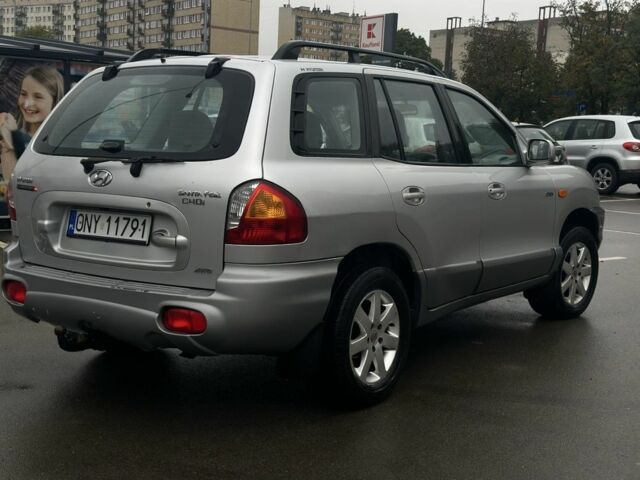 Серый Хендай Санта Фе, объемом двигателя 2 л и пробегом 241 тыс. км за 3159 $, фото 3 на Automoto.ua