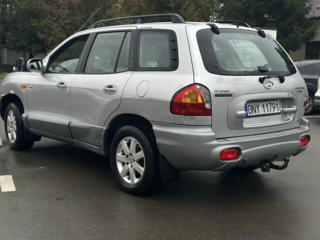 Серый Хендай Санта Фе, объемом двигателя 2 л и пробегом 241 тыс. км за 3159 $, фото 2 на Automoto.ua