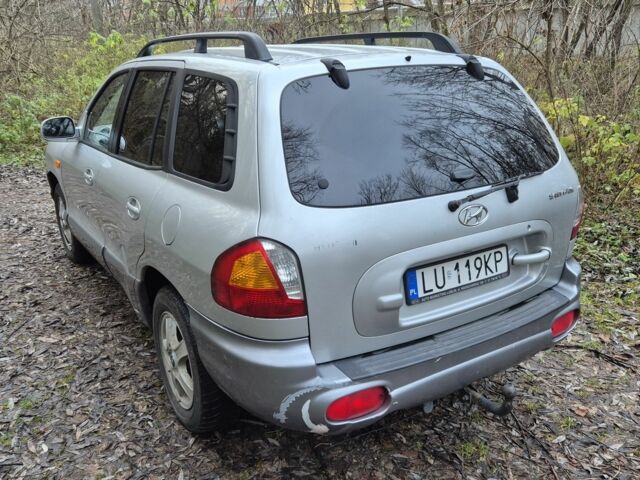 Серый Хендай Санта Фе, объемом двигателя 2 л и пробегом 316 тыс. км за 3801 $, фото 2 на Automoto.ua