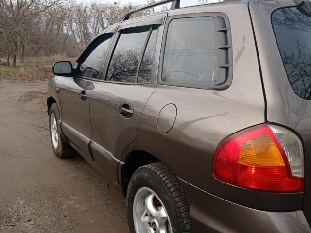 Серый Хендай Санта Фе, объемом двигателя 2.4 л и пробегом 320 тыс. км за 4500 $, фото 3 на Automoto.ua