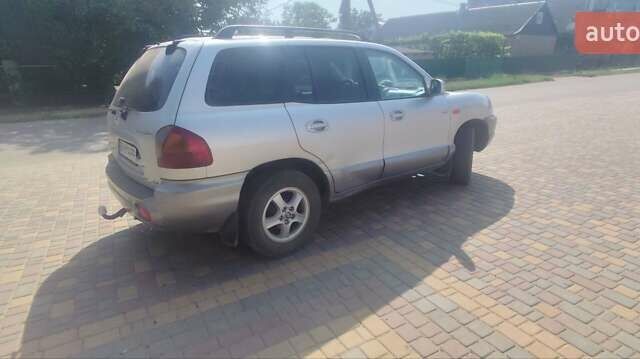 Серый Хендай Санта Фе, объемом двигателя 2 л и пробегом 294 тыс. км за 5700 $, фото 16 на Automoto.ua