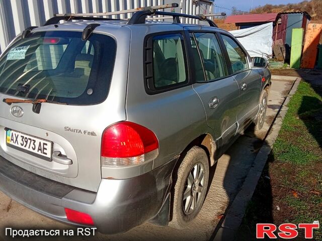 Серый Хендай Санта Фе, объемом двигателя 2 л и пробегом 252 тыс. км за 6000 $, фото 2 на Automoto.ua