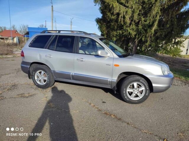 Серый Хендай Санта Фе, объемом двигателя 2 л и пробегом 237 тыс. км за 4200 $, фото 5 на Automoto.ua