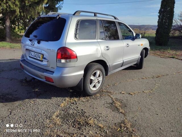 Сірий Хендай Санта Фе, об'ємом двигуна 2 л та пробігом 235 тис. км за 4099 $, фото 2 на Automoto.ua