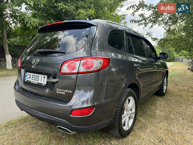 Серый Хендай Санта Фе, объемом двигателя 2.4 л и пробегом 226 тыс. км за 11700 $, фото 12 на Automoto.ua