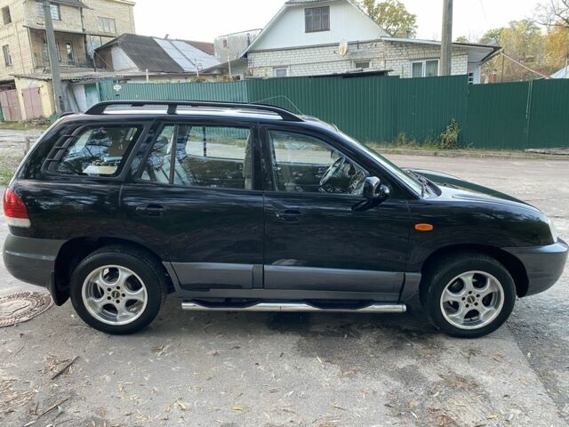 Синий Хендай Санта Фе, объемом двигателя 2.4 л и пробегом 145 тыс. км за 3900 $, фото 1 на Automoto.ua