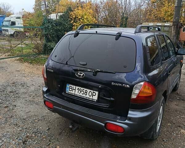 Синий Хендай Санта Фе, объемом двигателя 2.35 л и пробегом 346 тыс. км за 4700 $, фото 5 на Automoto.ua