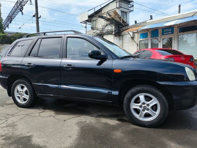 Синий Хендай Санта Фе, объемом двигателя 2 л и пробегом 370 тыс. км за 5999 $, фото 6 на Automoto.ua