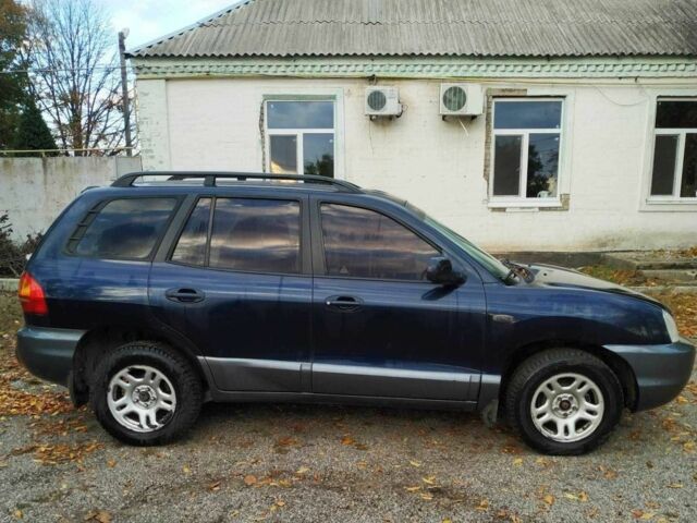 Синий Хендай Санта Фе, объемом двигателя 2 л и пробегом 223 тыс. км за 3114 $, фото 2 на Automoto.ua