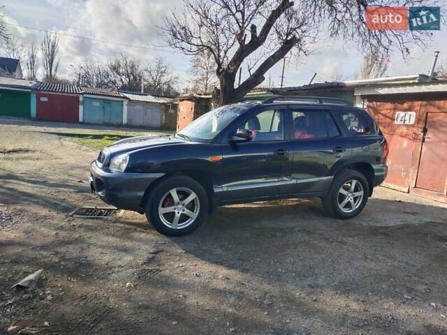 Синий Хендай Санта Фе, объемом двигателя 2.4 л и пробегом 293 тыс. км за 3500 $, фото 3 на Automoto.ua