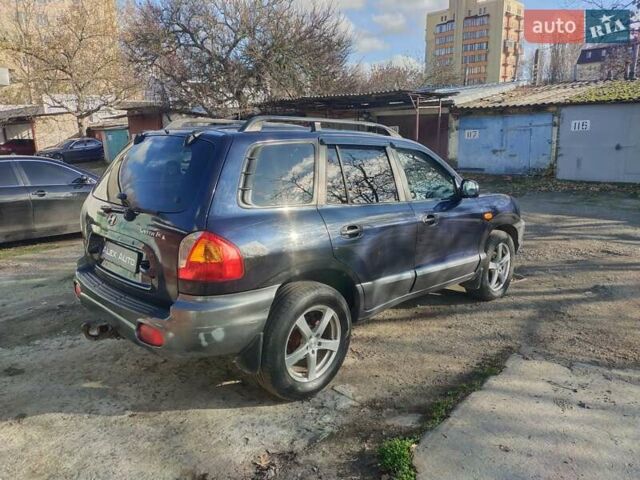 Синий Хендай Санта Фе, объемом двигателя 2.4 л и пробегом 293 тыс. км за 3500 $, фото 5 на Automoto.ua