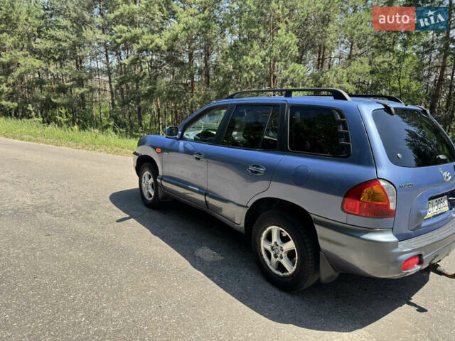 Синий Хендай Санта Фе, объемом двигателя 2 л и пробегом 225 тыс. км за 4800 $, фото 4 на Automoto.ua