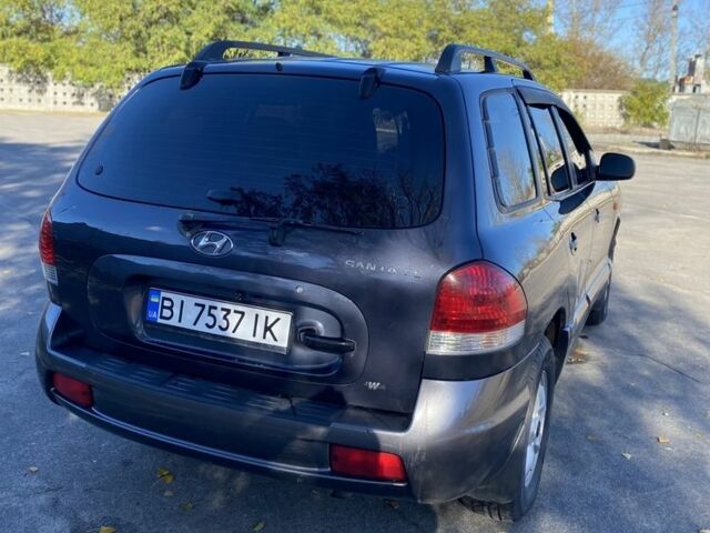 Синій Хендай Санта Фе, об'ємом двигуна 2.7 л та пробігом 257 тис. км за 5750 $, фото 3 на Automoto.ua