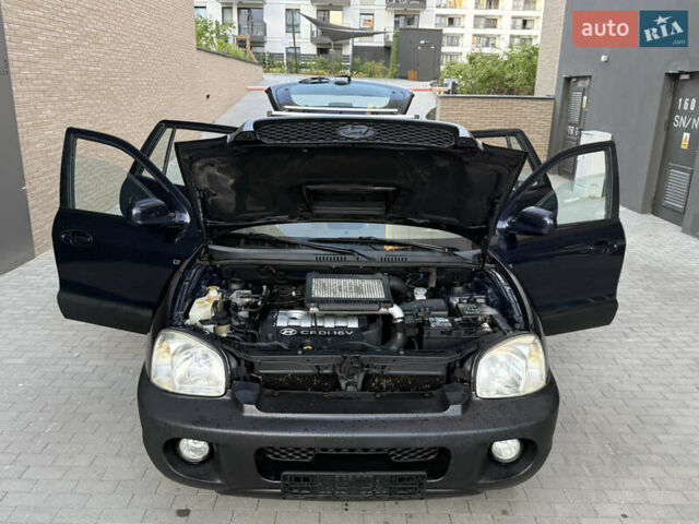 Синий Хендай Санта Фе, объемом двигателя 2 л и пробегом 258 тыс. км за 3950 $, фото 1 на Automoto.ua