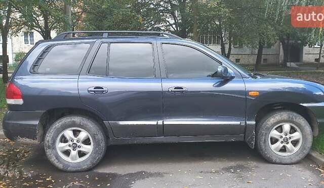 Синий Хендай Санта Фе, объемом двигателя 2.7 л и пробегом 336 тыс. км за 6000 $, фото 2 на Automoto.ua