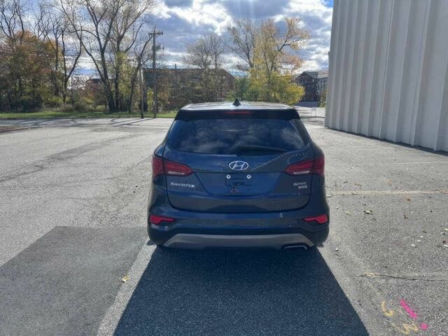 Синий Хендай Санта Фе, объемом двигателя 2.4 л и пробегом 61 тыс. км за 9100 $, фото 5 на Automoto.ua