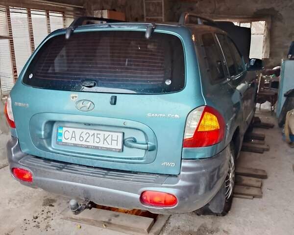 Зеленый Хендай Санта Фе, объемом двигателя 2 л и пробегом 300 тыс. км за 4200 $, фото 1 на Automoto.ua
