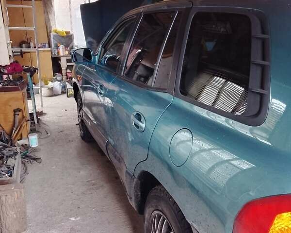 Зеленый Хендай Санта Фе, объемом двигателя 2 л и пробегом 300 тыс. км за 4200 $, фото 2 на Automoto.ua