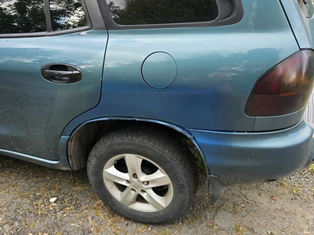 Зеленый Хендай Санта Фе, объемом двигателя 2 л и пробегом 350 тыс. км за 3349 $, фото 11 на Automoto.ua