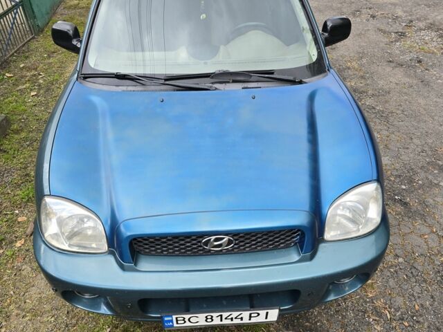 Зеленый Хендай Санта Фе, объемом двигателя 2 л и пробегом 350 тыс. км за 3349 $, фото 1 на Automoto.ua