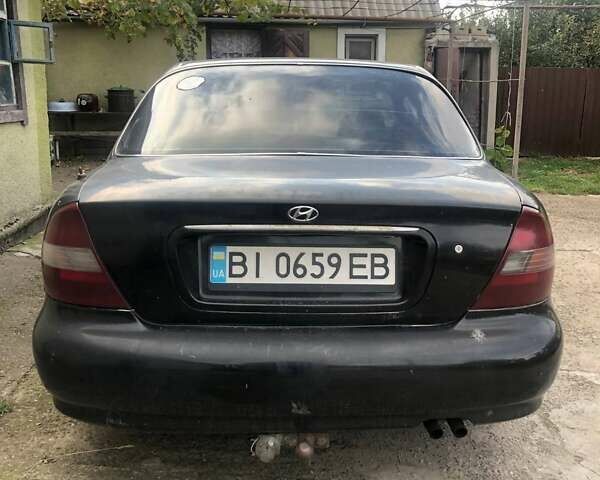 Чорний Хендай Соната, об'ємом двигуна 2 л та пробігом 400 тис. км за 2000 $, фото 4 на Automoto.ua