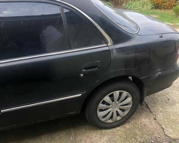 Чорний Хендай Соната, об'ємом двигуна 2 л та пробігом 400 тис. км за 2000 $, фото 7 на Automoto.ua