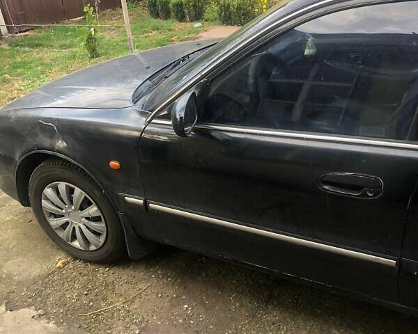 Чорний Хендай Соната, об'ємом двигуна 2 л та пробігом 400 тис. км за 2000 $, фото 6 на Automoto.ua