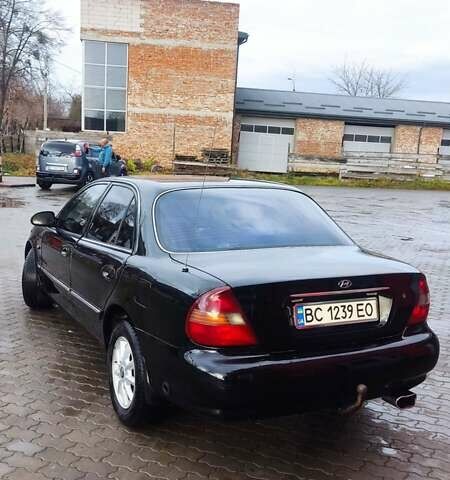 Черный Хендай Соната, объемом двигателя 2 л и пробегом 200 тыс. км за 1350 $, фото 5 на Automoto.ua