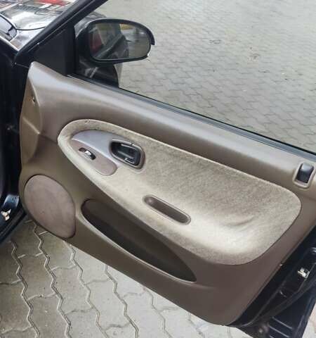 Черный Хендай Соната, объемом двигателя 2 л и пробегом 200 тыс. км за 1450 $, фото 16 на Automoto.ua