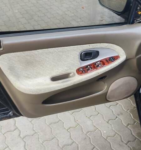 Черный Хендай Соната, объемом двигателя 2 л и пробегом 200 тыс. км за 1450 $, фото 15 на Automoto.ua