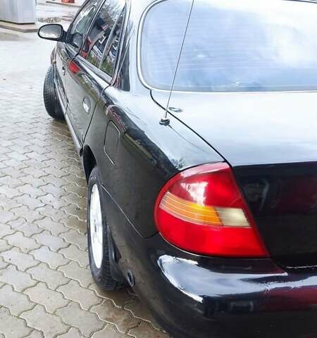 Черный Хендай Соната, объемом двигателя 2 л и пробегом 200 тыс. км за 1450 $, фото 8 на Automoto.ua