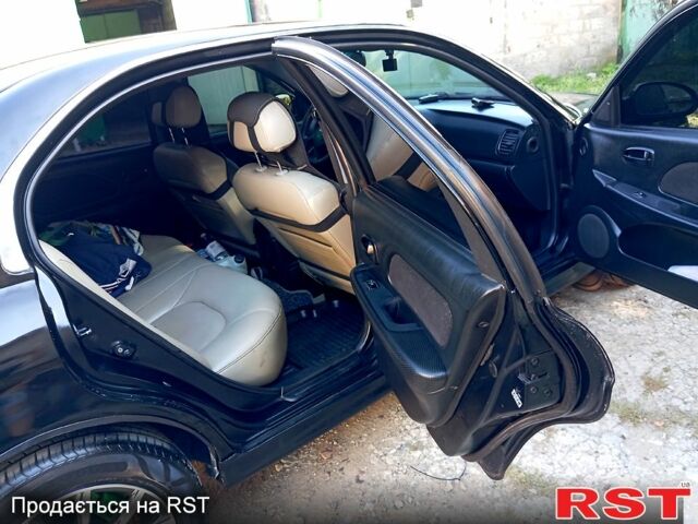 Черный Хендай Соната, объемом двигателя 2 л и пробегом 370 тыс. км за 4300 $, фото 6 на Automoto.ua