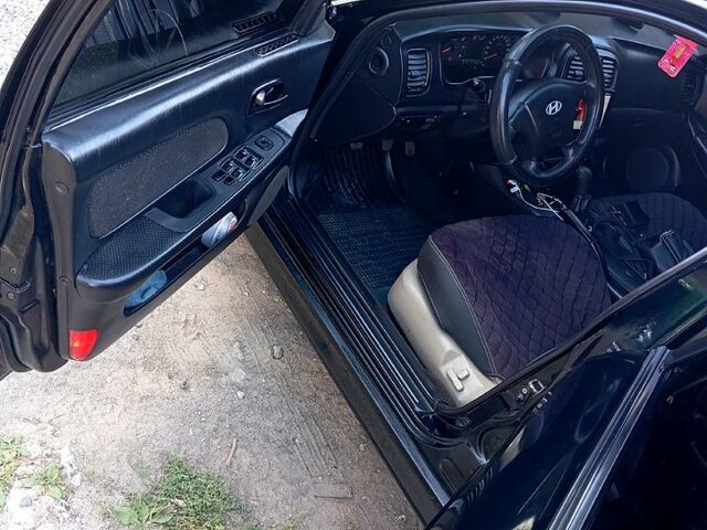 Черный Хендай Соната, объемом двигателя 2 л и пробегом 370 тыс. км за 4300 $, фото 7 на Automoto.ua