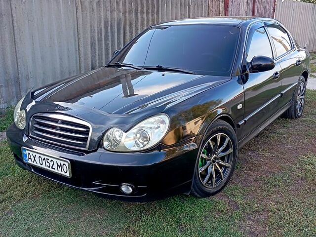 Черный Хендай Соната, объемом двигателя 2 л и пробегом 370 тыс. км за 4300 $, фото 1 на Automoto.ua