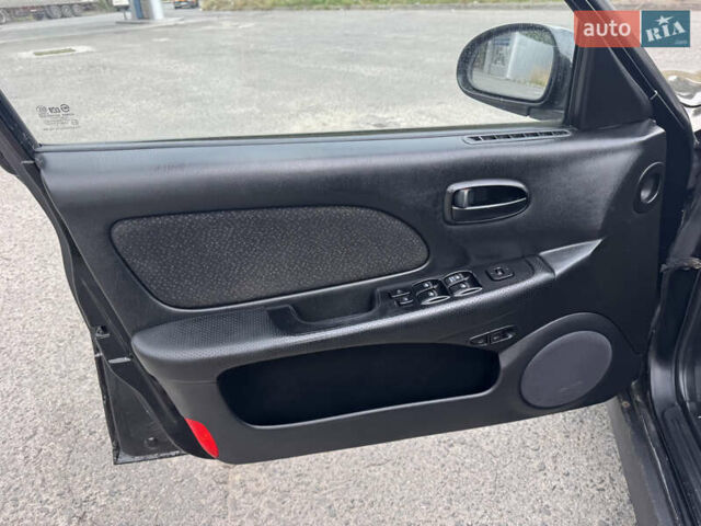 Черный Хендай Соната, объемом двигателя 2 л и пробегом 287 тыс. км за 2200 $, фото 10 на Automoto.ua