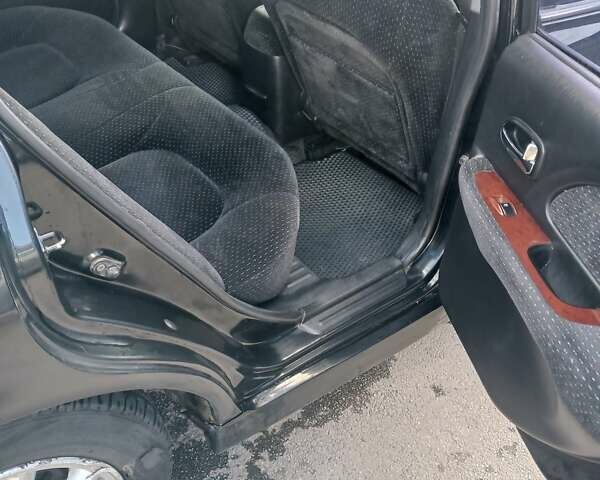 Черный Хендай Соната, объемом двигателя 2 л и пробегом 345 тыс. км за 2900 $, фото 30 на Automoto.ua