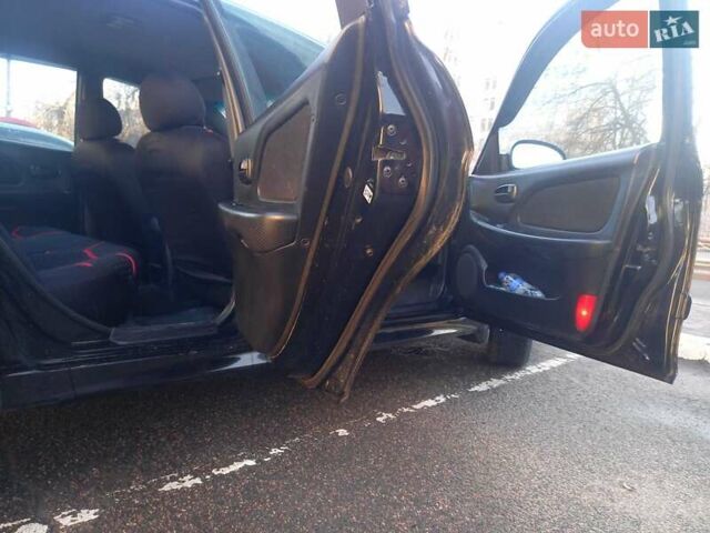 Черный Хендай Соната, объемом двигателя 2 л и пробегом 381 тыс. км за 3400 $, фото 23 на Automoto.ua