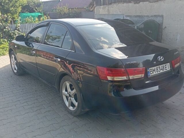 Черный Хендай Соната, объемом двигателя 2.4 л и пробегом 111 тыс. км за 5000 $, фото 4 на Automoto.ua