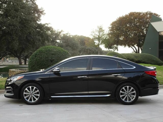 Черный Хендай Соната, объемом двигателя 2.4 л и пробегом 78 тыс. км за 2000 $, фото 2 на Automoto.ua