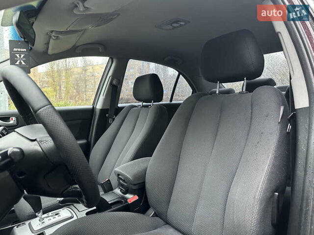 Коричневый Хендай Соната, объемом двигателя 2 л и пробегом 243 тыс. км за 5950 $, фото 6 на Automoto.ua