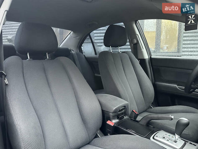 Коричневый Хендай Соната, объемом двигателя 2 л и пробегом 243 тыс. км за 5950 $, фото 7 на Automoto.ua