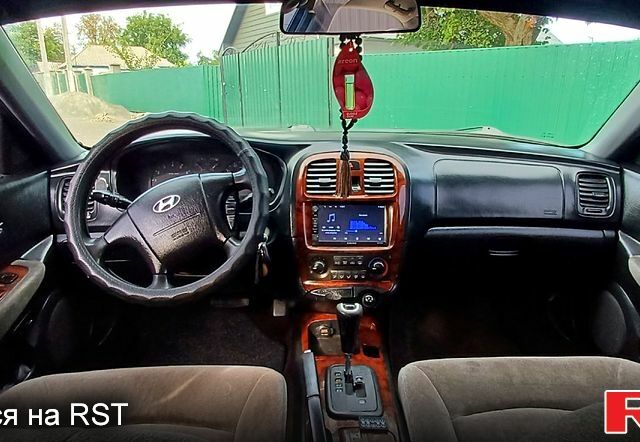 Синий Хендай Соната, объемом двигателя 2.7 л и пробегом 242 тыс. км за 3380 $, фото 1 на Automoto.ua