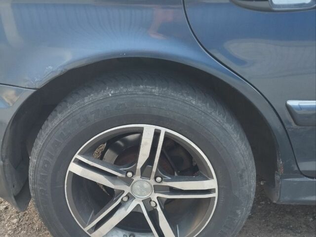 Синий Хендай Соната, объемом двигателя 2 л и пробегом 210 тыс. км за 3900 $, фото 5 на Automoto.ua