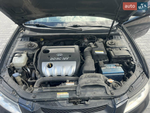 Синий Хендай Соната, объемом двигателя 2.36 л и пробегом 345 тыс. км за 5999 $, фото 9 на Automoto.ua