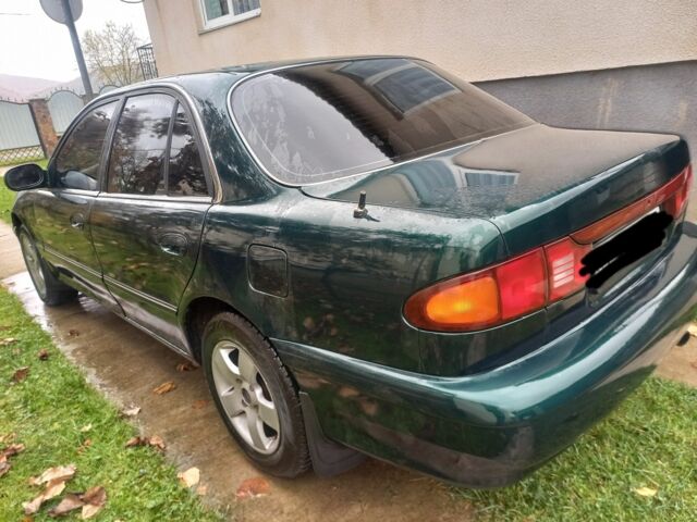 Зеленый Хендай Соната, объемом двигателя 2 л и пробегом 308 тыс. км за 1800 $, фото 3 на Automoto.ua