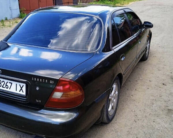 Зеленый Хендай Соната, объемом двигателя 2 л и пробегом 225 тыс. км за 2600 $, фото 2 на Automoto.ua