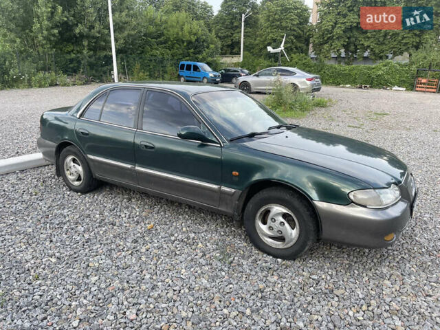 Зеленый Хендай Соната, объемом двигателя 2 л и пробегом 291 тыс. км за 1550 $, фото 3 на Automoto.ua