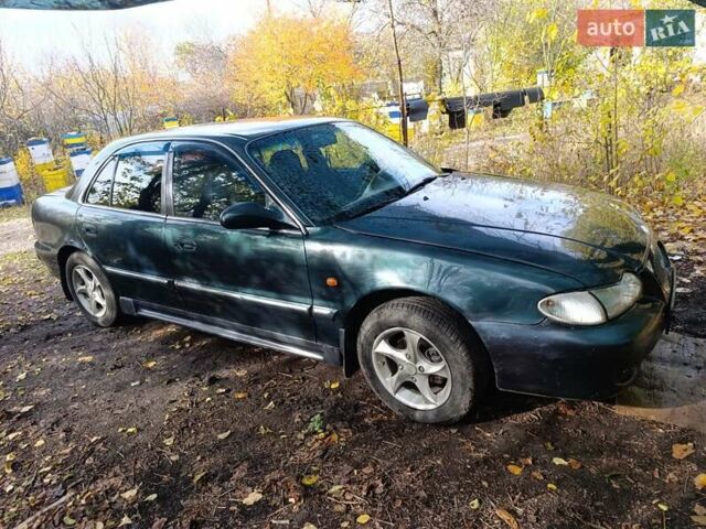 Зеленый Хендай Соната, объемом двигателя 2 л и пробегом 312 тыс. км за 1800 $, фото 1 на Automoto.ua